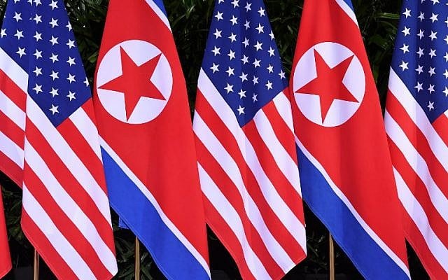 North Korean and US flags stand side by side at the location where North Korea's leader Kim Jong Un will meet with US President Donald Trump for a US-North Korea summit, at the Capella Hotel on Sentosa island in Singapore on June 12, 2018. (AFP PHOTO / SAUL LOEB) North Korean and US flags stand side by side at the location where North Korea's leader Kim Jong Un will meet with US President Donald Trump for a US-North Korea summit, at the Capella Hotel on Sentosa island in Singapore on June 12, 2018. (AFP PHOTO / SAUL LOEB)