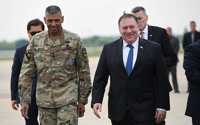 US Secretary of State Mike Pompeo, right, walks with US General Vincent K. Brooks commander of United States Forces Korea, upon his arrival at Osan Air Base in Pyeongtaek on June 13, 2018. (Jung Yeon-je/AFP) US Secretary of State Mike Pompeo, right, walks with US General Vincent K. Brooks commander of United States Forces Korea, upon his arrival at Osan Air Base in Pyeongtaek on June 13, 2018. (Jung Yeon-je/AFP)