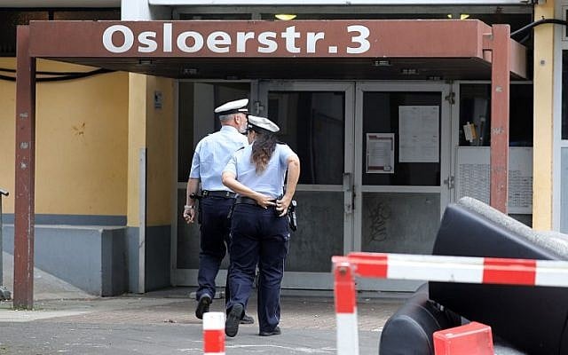 Policemen enter an apartment building in Cologne, western Germany, on June 14, 2018 where a Tunisian suspected of trying to build a biological weapon was arrested two days before. (AFP Photo/dpa/Oliver Berg) Policemen enter an apartment building in Cologne, western Germany, on June 14, 2018 where a Tunisian suspected of trying to build a biological weapon was arrested two days before. (AFP Photo/dpa/Oliver Berg)