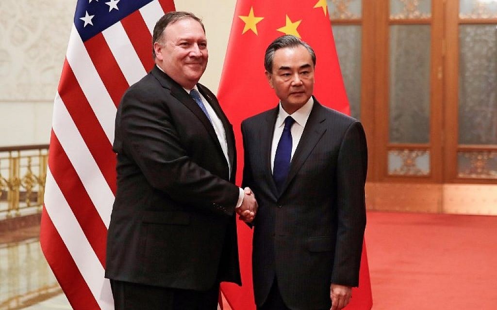 US Secretary of State Mike Pompeo (L) shakes hands with Chinese Foreign Minister Wang Yi before their meeting at the Great Hall of the People in Beijing on June 14, 2018 (AFP PHOTO / POOL / Andy Wong) US Secretary of State Mike Pompeo (L) shakes hands with Chinese Foreign Minister Wang Yi before their meeting at the Great Hall of the People in Beijing on June 14, 2018 (AFP PHOTO / POOL / Andy Wong)