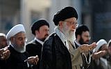 Ayatollah Ali Khamenei, right, leading the Eid al-Fitr prayers at the Imam Khomeini grand mosque in the capital Tehran on June 15, 2018. (Iranian Supreme Leader's Website/AFP)