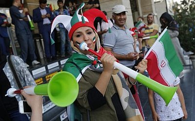 Iranians arrive to watch the World Cup Group B soccer match between Morocco and Iran at Azadi cinema in Tehran on June 15, 2018. (AFP Photo/Atta Kenare)