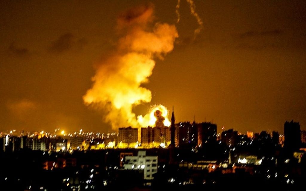 An explosion is seen in Gaza City after an airstrike by Israeli forces on June 18, 2018. (AFP/Mahmud Hams) An explosion is seen in Gaza City after an airstrike by Israeli forces on June 18, 2018. (AFP/Mahmud Hams)