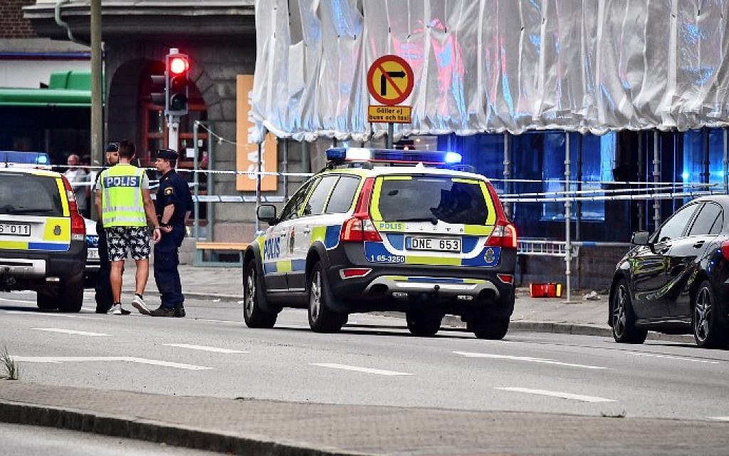 Illustrative: Police cordon off an area after four people were shot and injured on an open street in central Malmo, in southern Sweden, on June 18, 2018. (AFP PHOTO / TT News Agency / Johan NILSSON)