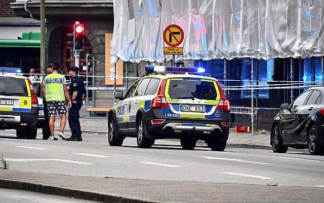 Illustrative: Police cordon off an area after four people were shot and injured on an open street in central Malmo, in southern Sweden, on June 18, 2018. (AFP PHOTO / TT News Agency / Johan NILSSON)