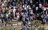 Ethiopian security forces intervene at Meskel Square in Addis Ababa on June 23, 2018, where a blast killed several people during a rally called by the Prime Minister Abiy Ahmed. (AFP Photo/Yonas Tadese)
