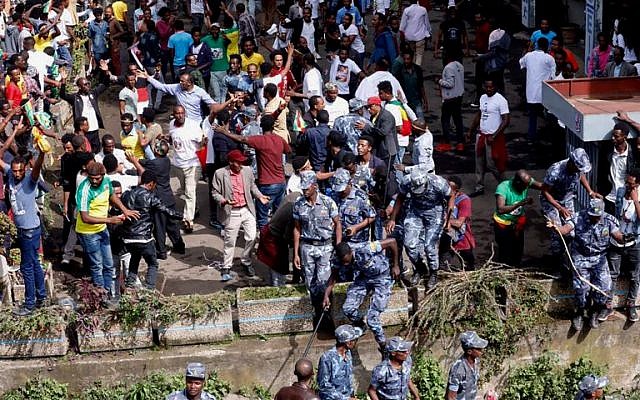 Ethiopian security forces intervene at Meskel Square in Addis Ababa on June 23, 2018, where a blast killed several people during a rally called by the Prime Minister Abiy Ahmed. (AFP Photo/Yonas Tadese) Ethiopian security forces intervene at Meskel Square in Addis Ababa on June 23, 2018, where a blast killed several people during a rally called by the Prime Minister Abiy Ahmed. (AFP Photo/Yonas Tadese)