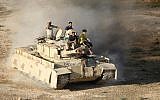 Syrian rebel fighters ride a tank in Daraa, southwestern Syria, on June 23, 2018. (Mohamad ABAZEED/AFP)