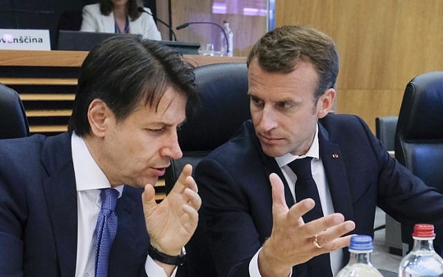 Italian Prime Minister Giuseppe Conte, left, speaks with French President Emmanuel Macron, right, during a summit on migration issues at EU headquarters in Brussels on June 24, 2018. (AFP Photo/Pool/Olivier Hoslet) Italian Prime Minister Giuseppe Conte, left, speaks with French President Emmanuel Macron, right, during a summit on migration issues at EU headquarters in Brussels on June 24, 2018. (AFP Photo/Pool/Olivier Hoslet)