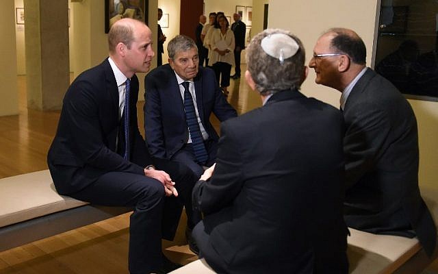 Britain's Prince William (L) and chairman of Yad Vashem Avner Shalev (2nd L) meet Kindertransport survivors during a visit at the Yad Vashem Holocaust memorial in Jerusalem on June 26, 2018. (AFP Photo/Pool/Debbie Hill)