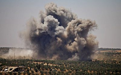 Smoke rises above opposition held areas of Daraa during airstrikes by Syrian regime forces on June 26, 2018. (Mohamad ABAZEED/AFP)