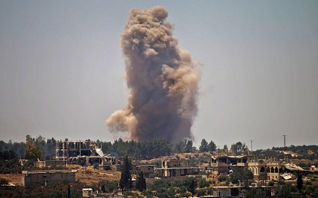 Smoke rises above opposition held areas of Daraa during airstrikes by Syrian regime forces on June 26, 2018. (AFP Photo/Mohamad Abazeed)