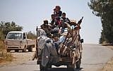 Displaced Syrians are seen leaving opposition-held areas of Daraa on June 26, 2018. ( Mohamad ABAZEED/AFP)