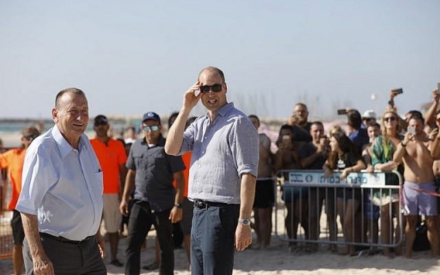 Britain's Prince William, center, walks with Tel Aviv Mayor Ron Huldai, left, as they visit a beach in the coastal Mediterranean city on June 26, 2018. (Menahem KAHANA/AFP) Britain's Prince William, center, walks with Tel Aviv Mayor Ron Huldai, left, as they visit a beach in the coastal Mediterranean city on June 26, 2018. (Menahem KAHANA/AFP)