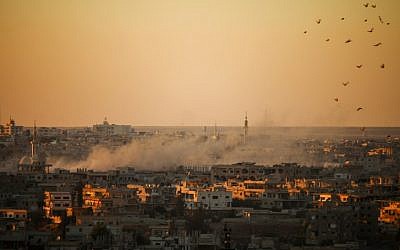 Smoke rises above opposition held areas of Daraa during airstrikes by Syrian regime forces on June 26, 2018. (AFP Photo/Mohamad Abazeed)