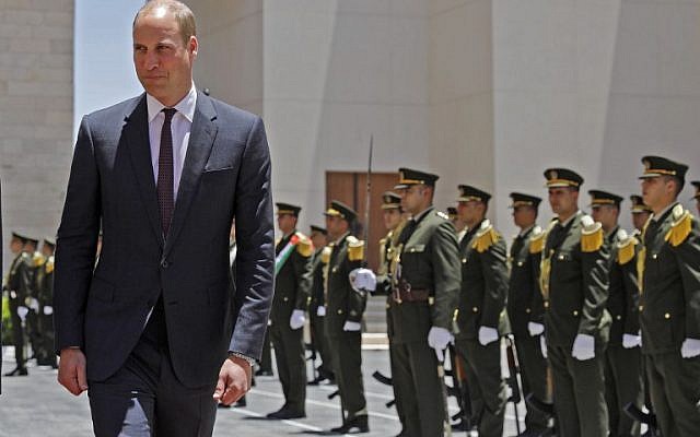Britain's Prince William reviews honour guards before meeting with the Palestinian president Mahmud Abbas in the West Bank city of Ramallah on June 27, 2018.  (AFP / AHMAD GHARABLI)
