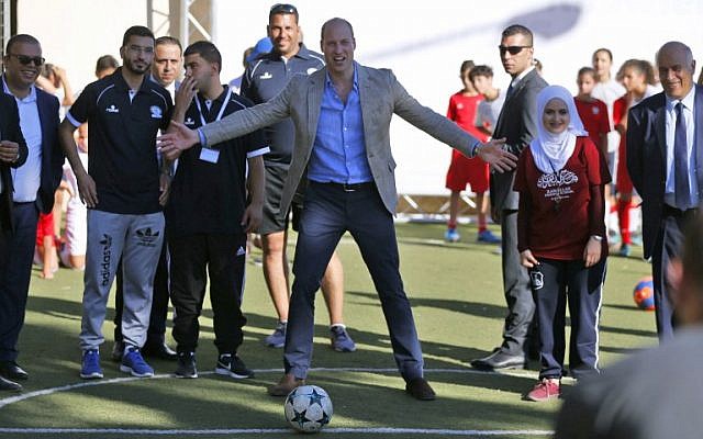 Britain's Prince William (C) prepares to shoot a soccer ball during his meeting with young Palestinian soccer players in the West Bank city of Ramallah on June 27, 2018. (AFP Photo/Abbas Momani) Britain's Prince William (C) prepares to shoot a soccer ball during his meeting with young Palestinian soccer players in the West Bank city of Ramallah on June 27, 2018. (AFP Photo/Abbas Momani)