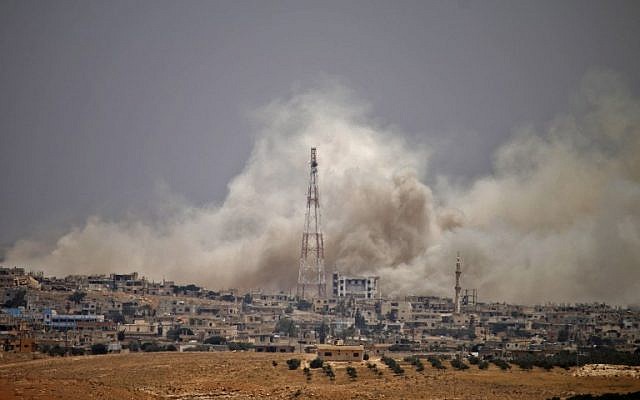 Smoke rises above opposition held areas of the city of Daraa during airstrikes by Syrian regime forces on June 28, 2018. (AFP PHOTO / Mohamad ABAZEED) Smoke rises above opposition held areas of the city of Daraa during airstrikes by Syrian regime forces on June 28, 2018. (AFP PHOTO / Mohamad ABAZEED)