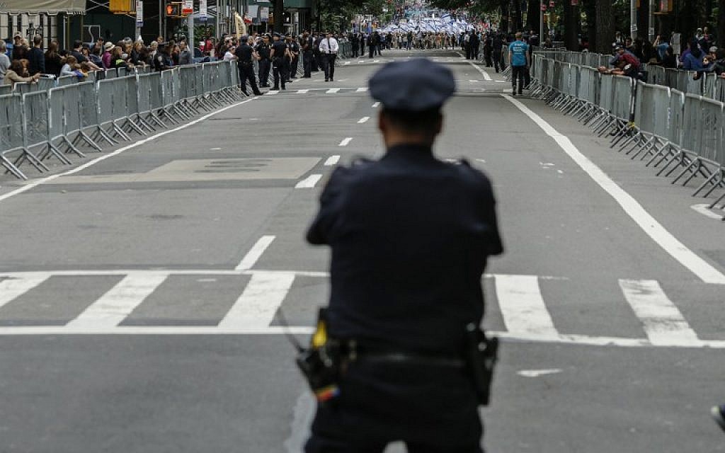 An NYPD officer stands guard during the annual Celebrate Israel Parade on June 3, 2018 in New York City. (Kena Betancur/Getty Images/AFP) An NYPD officer stands guard during the annual Celebrate Israel Parade on June 3, 2018 in New York City. (Kena Betancur/Getty Images/AFP)