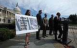 Rep. Luis Gutierrez holds up a picture of his daughter and grandson during a news conference to urge the Trump administration into ending its policy of separating families at the US- Mexico border on Capitol Hill June 14, 2018 in Washington, DC.   (Mark Wilson/Getty Images/AFP)