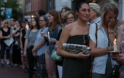 People line up on both sides of Main St. during a candlelight vigil to honor the 5 people were shot and killed at the Capital Gazette newpaper  on June 29, 2018 in Annapolis, Maryland. (Mark Wilson/Getty Images/AFP)