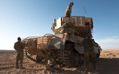A group of female soldiers take part in a training exercise in the tank commanders' course, in an undated photograph. (Israel Defense Forces)