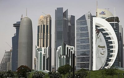 In this May 5, 2018 photo, a giant image of the Emir of Qatar Sheikh Tamim bin Hamad Al Thani, adorns a tower in Doha, Qatar. (AP Photo/Kamran Jebreili)