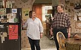 In this image released by ABC, Roseanne Barr, left, and John Goodman appear in a scene from "Roseanne." (Adam Rose/ABC via AP)