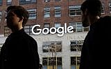 People walk by Google offices in New York, December 4, 2017. (AP/Mark Lennihan)