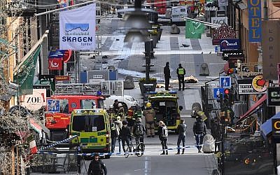 Emergency services at the scene of an attack on Drottninggatan street in central Stockholm, April 7, 2017. (Fredrik Sandberg/TT via AP, File)