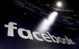 Facebook logo on screens at the Nasdaq MarketSite in New York's Times Square, March 29, 2018. (AP Photo/Richard Drew, File)
