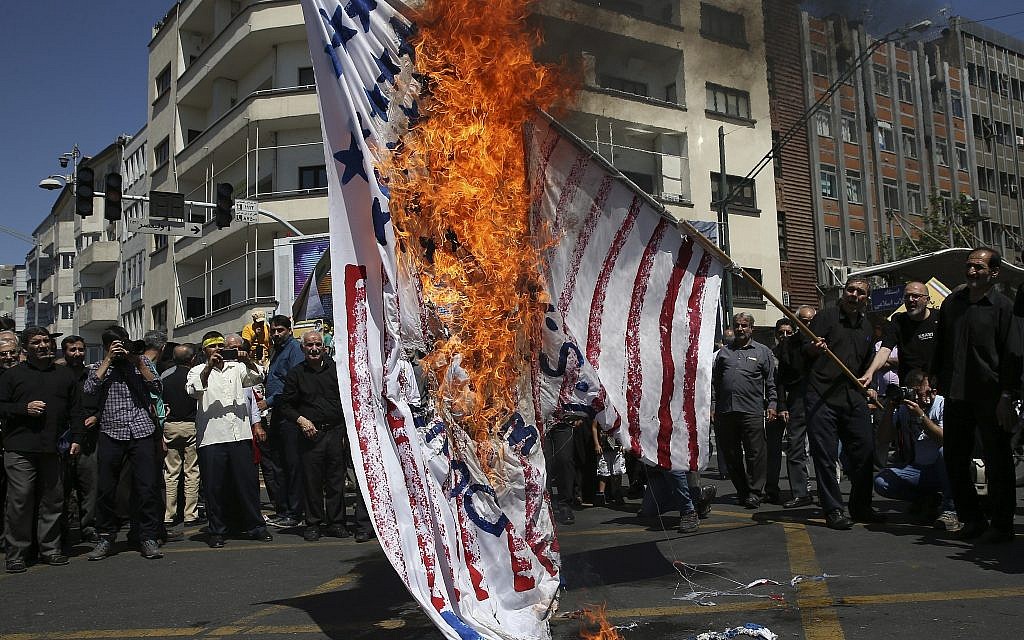 Iranian protesters burn a representation of the US flag in their annual anti-Israeli Al-Quds, Jerusalem, Day rally in Tehran, Iran, June 8, 2018. (Vahid Salemi/AP) Iranian protesters burn a representation of the US flag in their annual anti-Israeli Al-Quds, Jerusalem, Day rally in Tehran, Iran, June 8, 2018. (Vahid Salemi/AP)