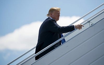 US President Donald Trump boards Air Force One for a trip to Singapore to meet with North Korean leader Kim Jong Un, at Canadian Forces Base Bagotville, in Canada, June 9, 2018. (Evan Vucci/AP)