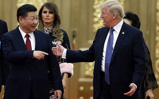 In this Nov. 9, 2017, file photo, US President Donald Trump (right) and China's President Xi Jinping arrive for a state dinner at the Great Hall of the People in Beijing, China. (Thomas Peter/Pool) In this Nov. 9, 2017, file photo, US President Donald Trump (right) and China's President Xi Jinping arrive for a state dinner at the Great Hall of the People in Beijing, China. (Thomas Peter/Pool)