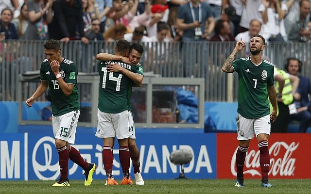 Mexico's Hirving Lozano, center, celebrates scoring his side's opening goal during a match against Germany at the 2018 soccer World Cup in the Luzhniki Stadium in Moscow, Russia, June 17, 2018. (Antonio Calanni/AP) Mexico's Hirving Lozano, center, celebrates scoring his side's opening goal during a match against Germany at the 2018 soccer World Cup in the Luzhniki Stadium in Moscow, Russia, June 17, 2018. (Antonio Calanni/AP)