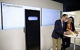 Dan Zafrir, left, and Noa Ovadia, right, prepare for their debate against the IBM Project Debater on June 18, 2018, in San Francisco. (AP Photo/Eric Risberg)