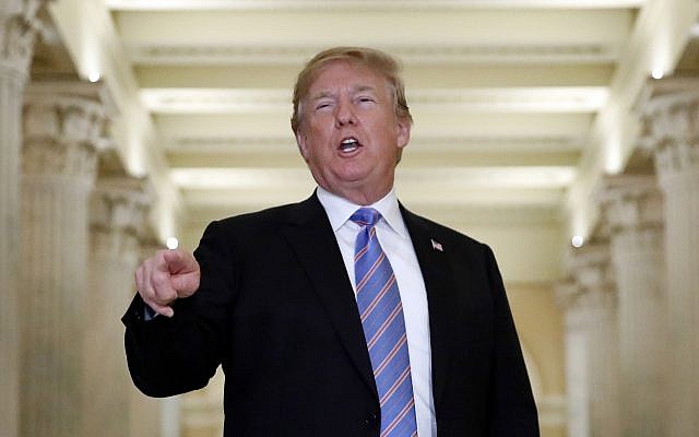US President Donald Trump speaks in the Hall of Columns as he arrives on Capitol Hill in Washington, June 19, 2018, to rally Republicans around a GOP immigration bill. (AP Photo/Alex Brandon) US President Donald Trump speaks in the Hall of Columns as he arrives on Capitol Hill in Washington, June 19, 2018, to rally Republicans around a GOP immigration bill. (AP Photo/Alex Brandon)