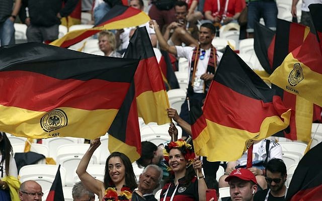 Fan wave German flags as they wait for the start of the group F match between South Korea and Germany, at the 2018 soccer World Cup in the Kazan Arena in Kazan, Russia, Wednesday, June 27, 2018. (AP/Thanassis Stavrakis)