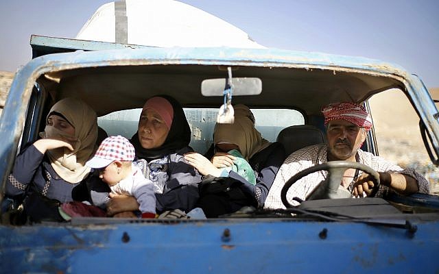Syrian refugees gather in their vehicles getting ready to cross into Syria from the eastern Lebanese border town of Arsal, Lebanon, Thursday, June 28, 2018. Dozens of Syrian refugees in Lebanon have started to cross the border, going back home to war-torn Syria. (AP Photo/Bilal Hussein) Syrian refugees gather in their vehicles getting ready to cross into Syria from the eastern Lebanese border town of Arsal, Lebanon, Thursday, June 28, 2018. Dozens of Syrian refugees in Lebanon have started to cross the border, going back home to war-torn Syria. (AP Photo/Bilal Hussein)