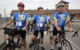Three-time Tour de France winner Greg LeMond, right, Marcel Zielinski, a Holocaust survivor, center, and Jonathan Ornstein, the director of the Jewish Community Center of Krakow, pose for the media in Oswiecim, Poland, on Friday June 29, 2018. Three-time Tour de France winner Greg LeMond, two Holocaust survivors and dozens of others took part in a symbolic ride from Auschwitz-Birkenau to a Jewish cultural center in Poland to support the renewal of Jewish life.(AP Photo/Katarzyna Bednarczyk)