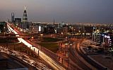 Saudi Arabian city view with the Kingdom Tower, background, and 'Al-Faislia Tower' in Riyadh, Saudi Arabia, February 9, 2011. (AP Photo/Hassan Ammar)