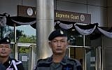 Illustrative: A Thai police officers stand guard outside a courthouse  Wednesday, Aug. 2, 2017, in Bangkok, Thailand (AP Photo/Gemunu Amarasinghe)