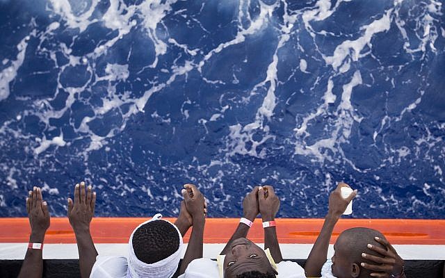 African migrants stand on the deck of the Aquarius vessel of the "SOS Mediterranee" and MSF (Doctors Without Borders) NGOs, in the Mediterranean Sea, southwest of Malta, Thursday, August 31, 2017. (AP/Darko Bandic) African migrants stand on the deck of the Aquarius vessel of the "SOS Mediterranee" and MSF (Doctors Without Borders) NGOs, in the Mediterranean Sea, southwest of Malta, Thursday, August 31, 2017. (AP/Darko Bandic)