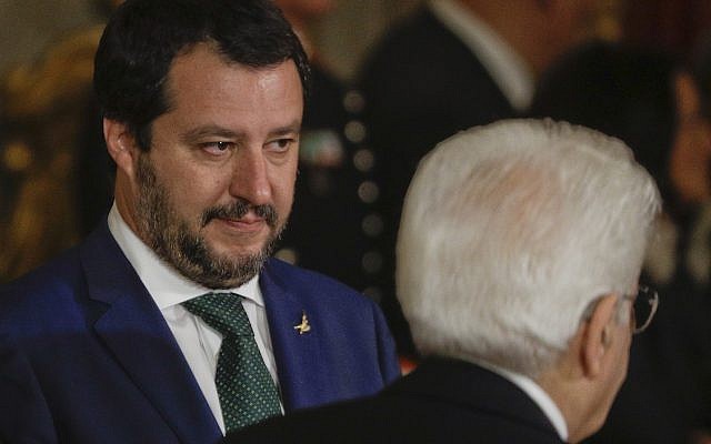New Italian Interior Minister Matteo Salvini, left, looks at Italian President Sergio Mattarella passing by, during the swearing-in ceremony for Italy's new government at Rome's Quirinale Presidential Palace, Friday, June 1, 2018. (AP Photo/Gregorio Borgia) New Italian Interior Minister Matteo Salvini, left, looks at Italian President Sergio Mattarella passing by, during the swearing-in ceremony for Italy's new government at Rome's Quirinale Presidential Palace, Friday, June 1, 2018. (AP Photo/Gregorio Borgia)