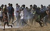 Volunteer paramedic Razan al-Najjar, 21, center, is seen before reportedly being shot in her chest by Israeli troops during a protest east of Khan Younis, Gaza Strip, Friday, June 1, 2018 (AP Photo/Adel Hana)