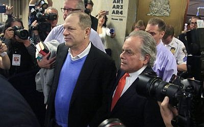 Harvey Weinstein, center, leaves with his lawyer Benjamin Brafman, right, after posting bail at Manhattan's Criminal Court, Friday, May 25, 2018, in New York (AP Photo/Bebeto Matthews)