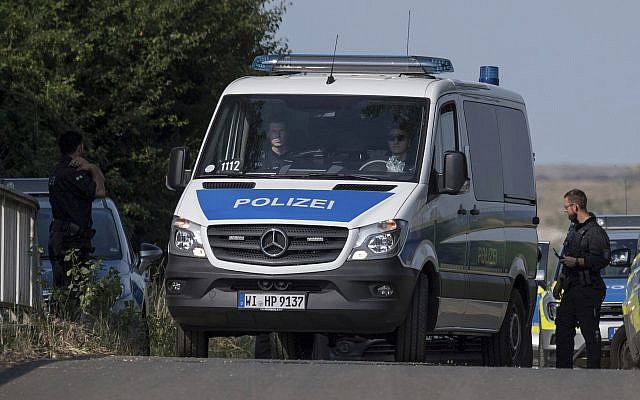 Police officers block a road near Wiesbaden, Germany, June 7, 2018. (Boris Roessler/dpa via AP) Police officers block a road near Wiesbaden, Germany, June 7, 2018. (Boris Roessler/dpa via AP)