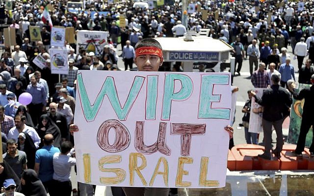 An Iranian protester holds an anti-Israeli placard during an annual anti-Israeli Al-Quds, Jerusalem, Day rally in Tehran, Iran, Friday, June 8, 2018 (AP Photo/Ebrahim Noroozi)