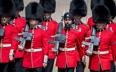 Charanpreet Singh Lall, second right, one of the Coldstream Guards, marches during the Trooping the Colour ceremony at Horse Guards Parade as Queen Elizabeth II celebrates her official birthday, in London, June 9, 2018. (Victoria Jones/PA via AP)