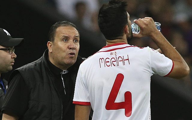 In this Saturday, June 9, 2018 file photo, Tunisia's head coach Nabil Maloul, left, speaks with Tunisia's Yassine Meriah, who drinks water during a friendly soccer match against Spain in Krasnodar, Russia. (AP Photo, File) In this Saturday, June 9, 2018 file photo, Tunisia's head coach Nabil Maloul, left, speaks with Tunisia's Yassine Meriah, who drinks water during a friendly soccer match against Spain in Krasnodar, Russia. (AP Photo, File)